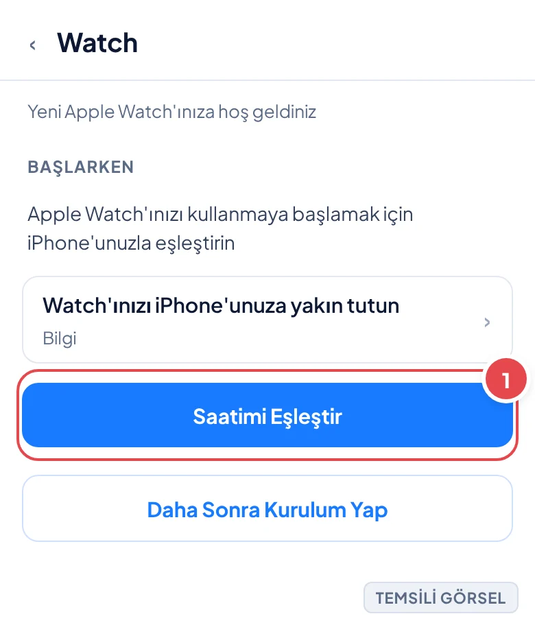 Temsili görsel: Watch uygulaması açılış ekranı; işaretli: 1. Saatimi Eşleştir butonu