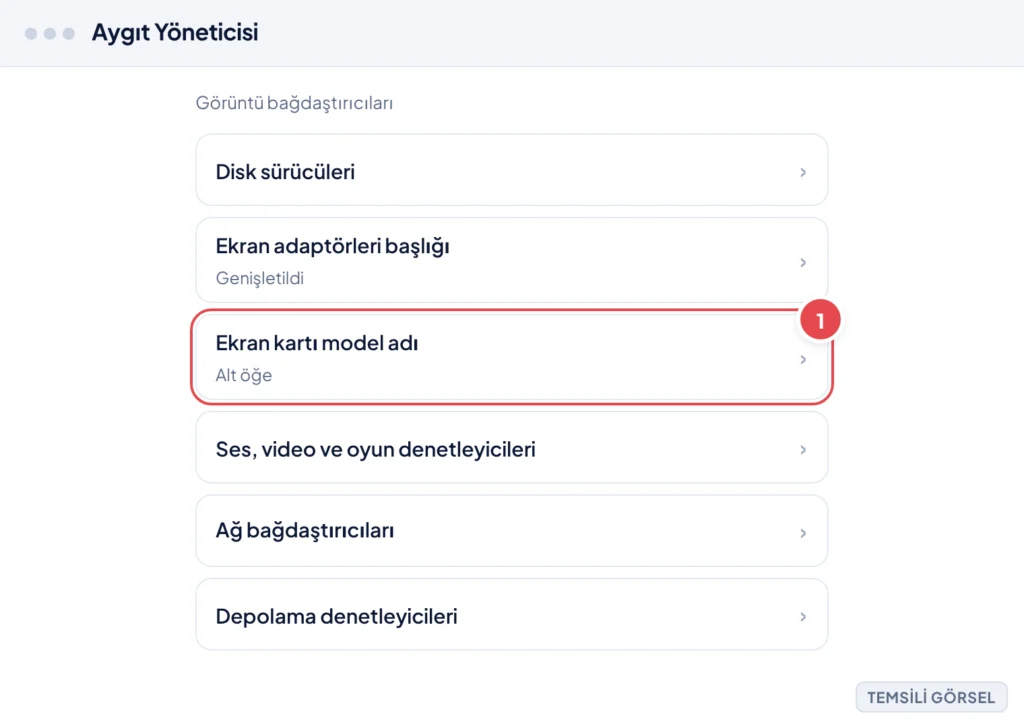 Temsili görsel: Aygıt Yöneticisi ekranı, Görüntü bağdaştırıcıları bölümü genişletilmiş, altında ekran kartı model adının listelendiği görünüm; işaretli: 1. Ekran kartı model adı satırı